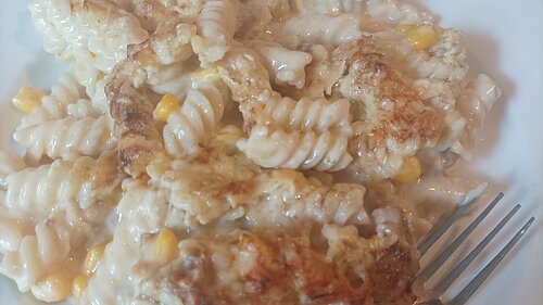 Food on plate with fork (pasta)