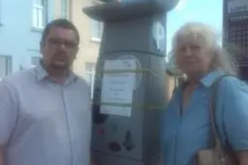 Sandgate and Folkestone West County Councillor Tim Prater and Sandgate Parish Councillor Ann Rimmer by the newly installed pay and display machine at Sandgate's Castle Road Car Park