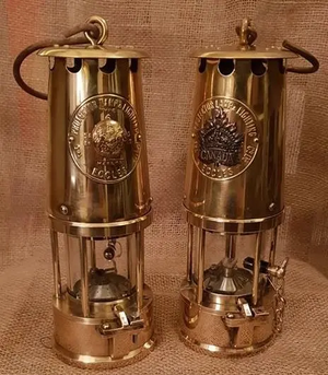 Image courtesy of The Shorncliffe Trust "Maple & Tommy" WW1 replica lanterns: The Canadian ”Maple” Lantern incorporates an original WW1 Canadian Maple Leaf cap badge as its emblem. The British “Tommy” Lantern has an original WW1 brass British general service uniform button as its emblem.
