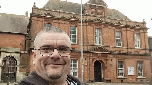 Tim Prater outside Grace Hill Library and Museum building, Folkestone