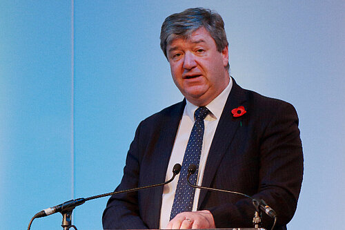 Alistair Carmichael speaks at a podium